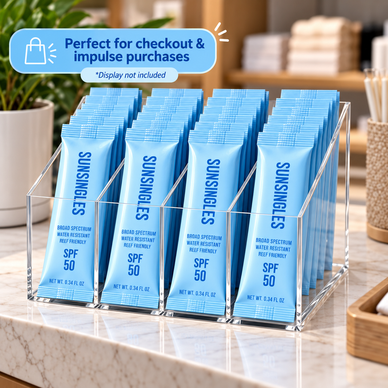 Wholesale SunSingles SPF 50 sunscreen packets in a countertop checkout display for retail stores