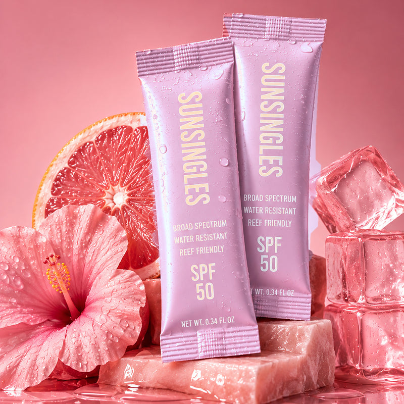 Pink SunSingles SPF 50 sunscreen packets with grapefruit, hibiscus and ice